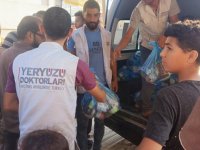 Yeryüzü Doktorları Gazze'de temel ihtiyaç malzemesi dağıtıyor